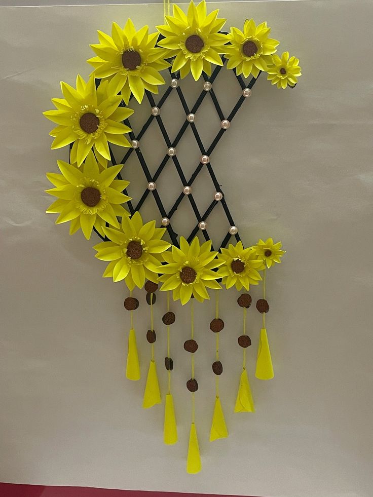 a clock with sunflowers hanging from it's face