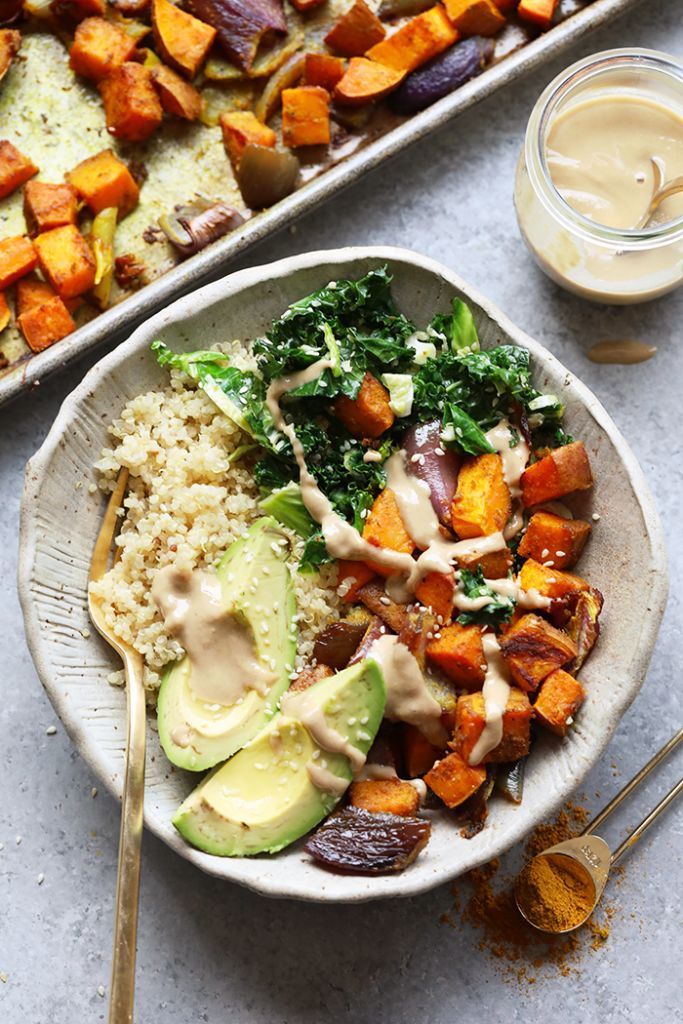 a white plate topped with vegetables and rice next to a tray of sweet potato casserole