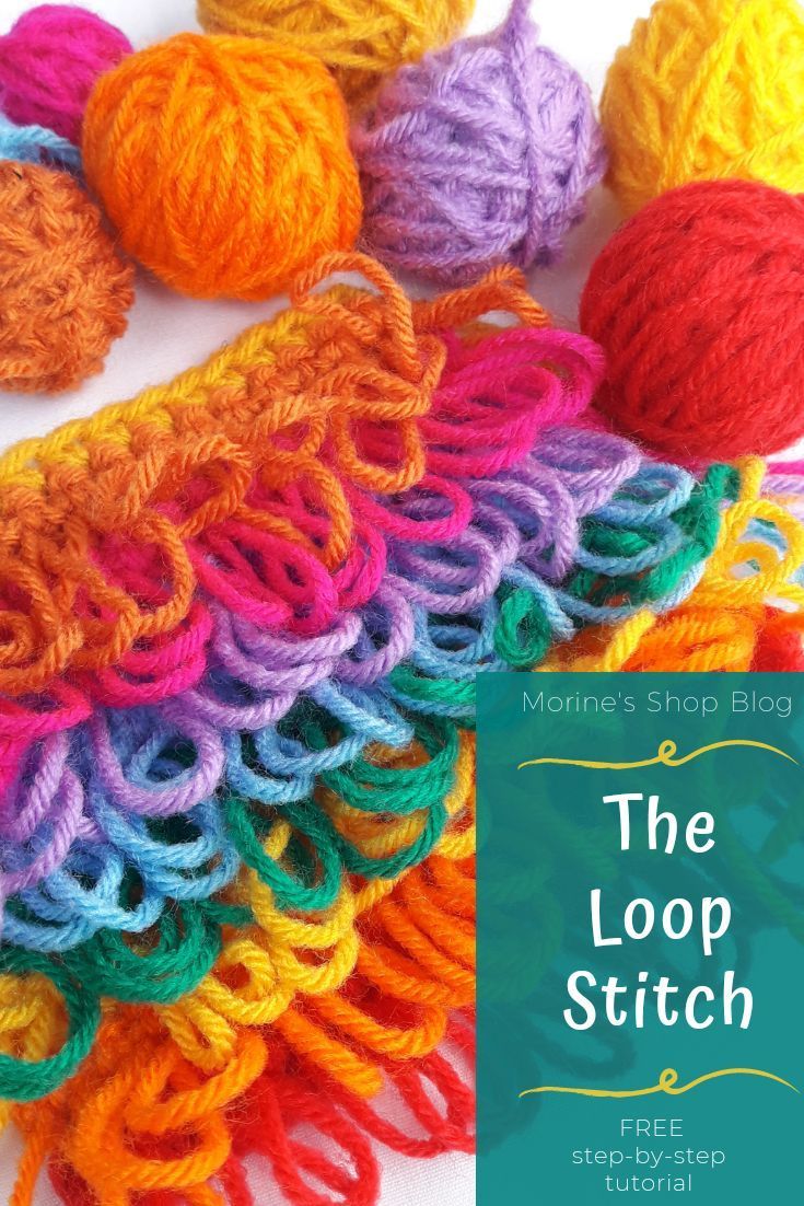 the loop stitch book cover with yarn balls and crochet hooks on it