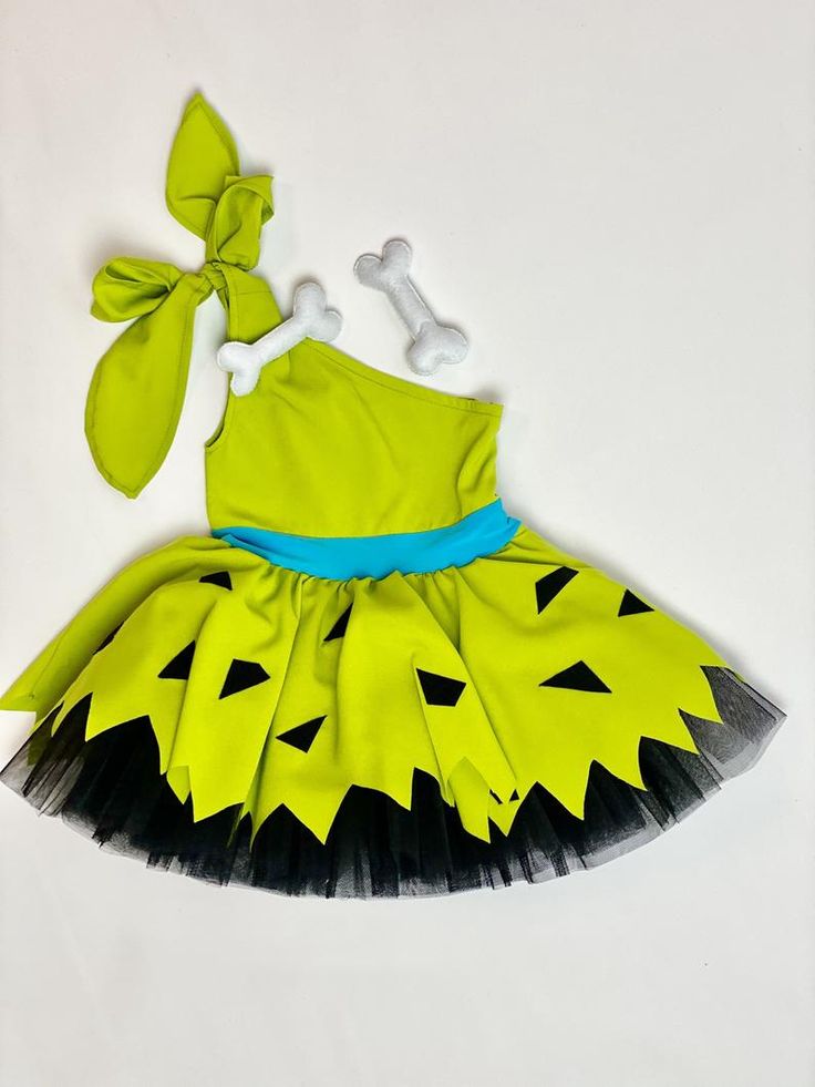 a dress made to look like a monster with bones and bones on the chest, attached to a headband