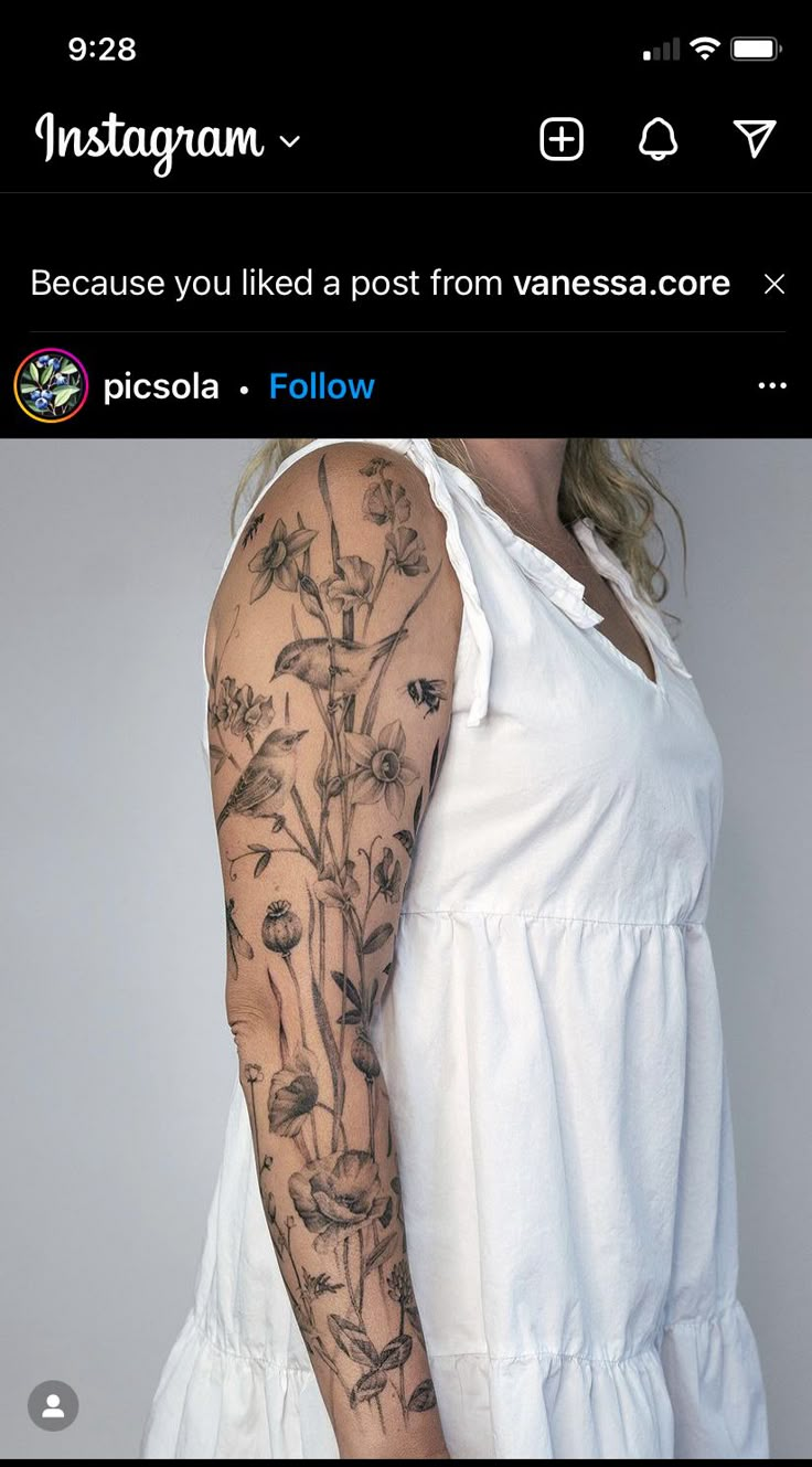 a woman's arm with flowers on it