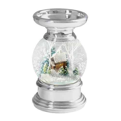 a snow globe with a house in it