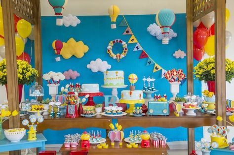 a birthday party with balloons, cake and decorations