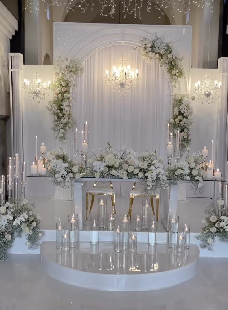 a table with candles and flowers on it