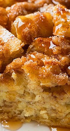 a close up of a piece of cake on a plate with fruit in the background