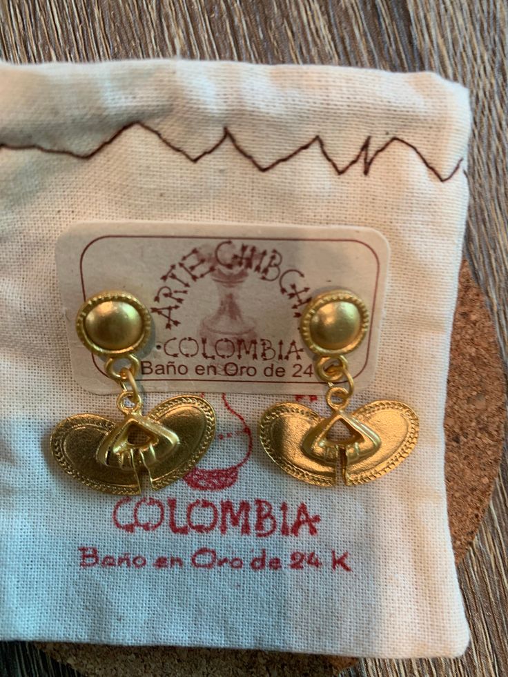 Throughout generations of my Colombian family till this day, we have threaded each bead and shaped every earring into beautiful artisan PreColombian jewelry. Every piece is inspired by at least one part of Colombia's precious nature. Gold Bohemian Jewelry For Souvenir, Traditional Gold Souvenir Jewelry, Traditional Gold Jewelry Souvenir, Traditional Gold Jewelry For Souvenir, Traditional Gold Jewelry As Souvenir, Traditional Handwoven Gold Jewelry, Traditional Handwoven Drop Earrings, Unique Gold Jewelry As A Souvenir, Handwoven Brass Dangle Earrings