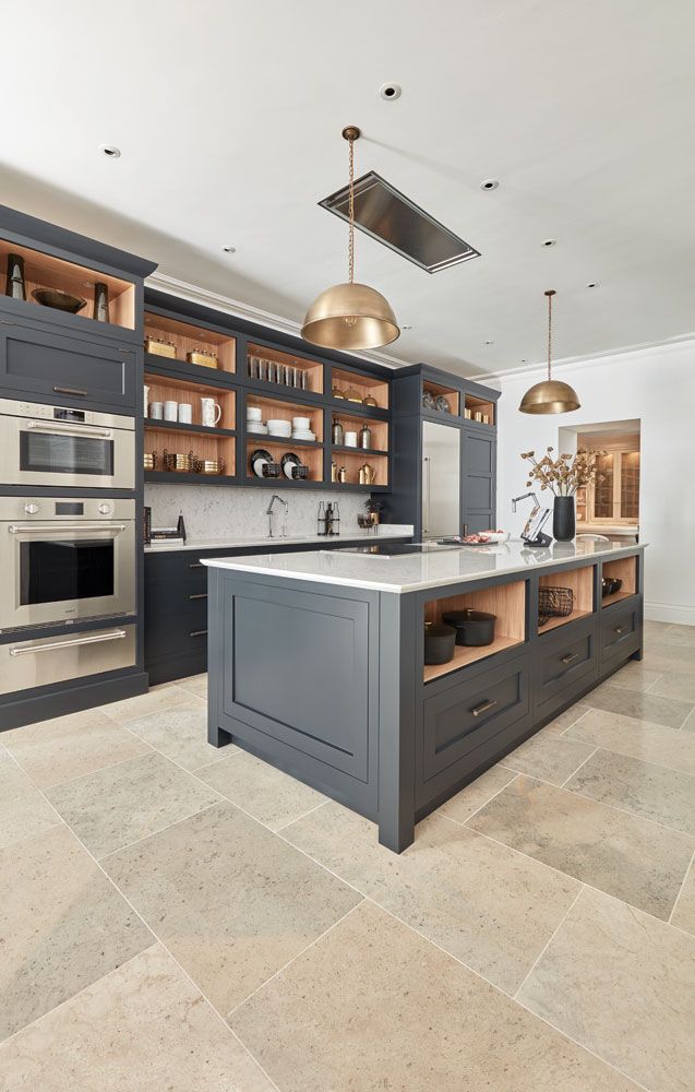 a large kitchen with an island in the middle