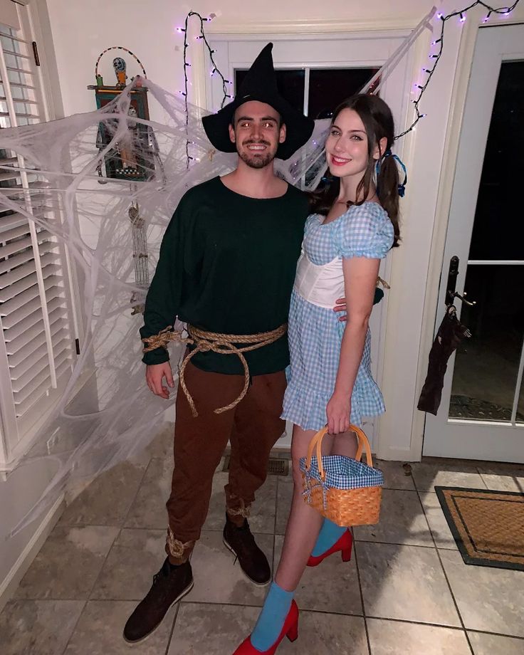 a man and woman dressed up in costumes