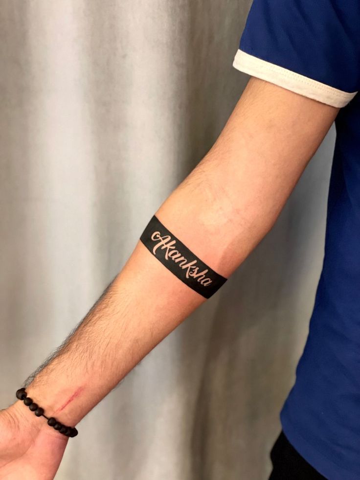 a man wearing a wristband with the word hope on it