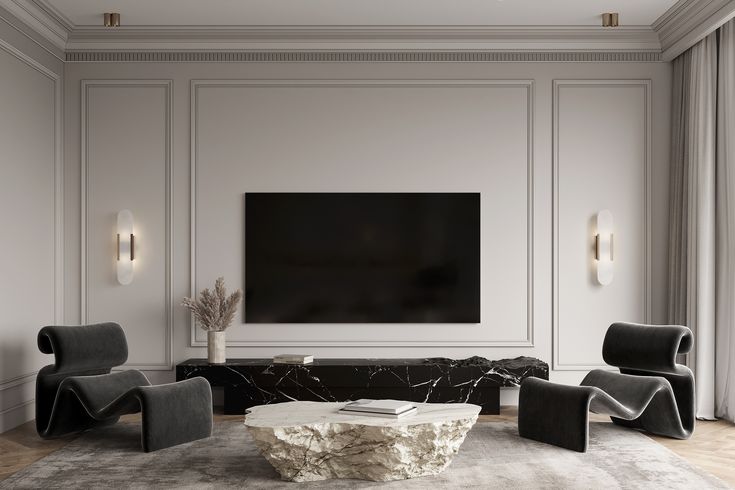 an elegant living room with white walls and black furniture, along with a large flat screen tv mounted on the wall