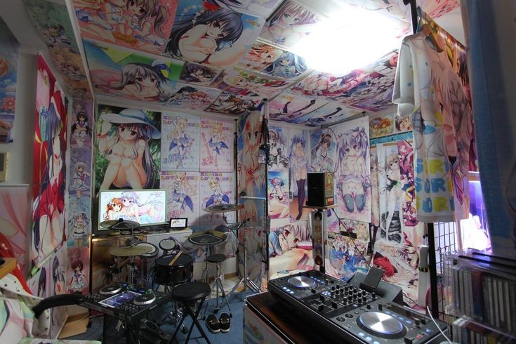 a room that has various wallpapers and dj equipment on the floor in front of it