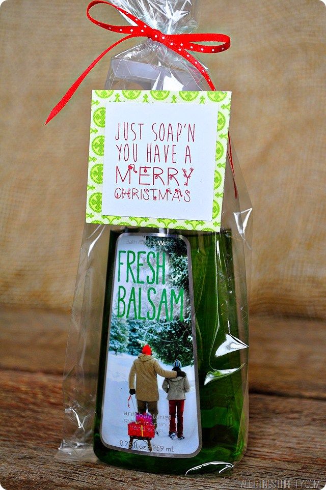 a christmas ornament is wrapped in cellophane and has a card attached to it