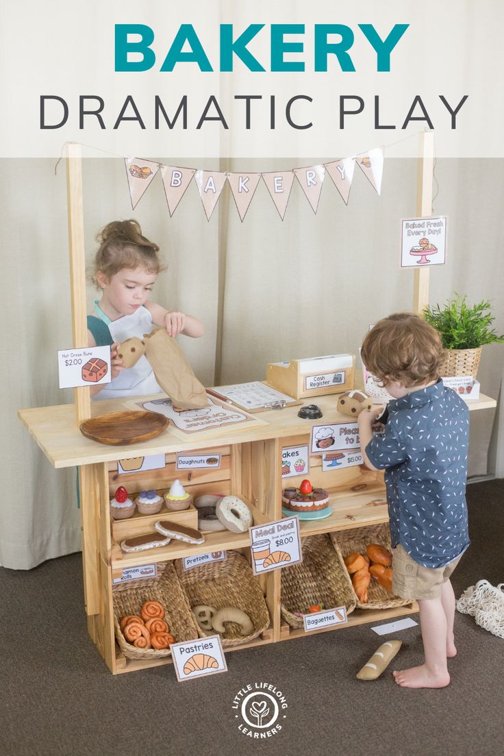 two children playing with wooden toys in front of a display case that says bakery dramatic play