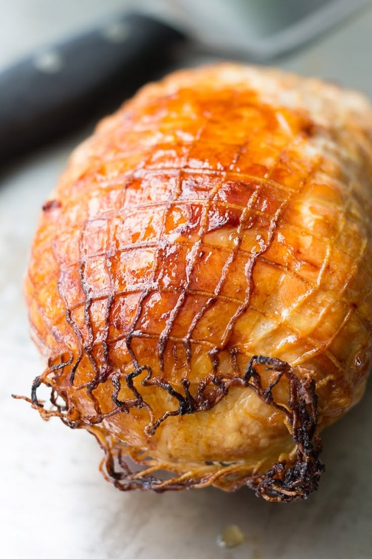 a piece of meat sitting on top of a cutting board