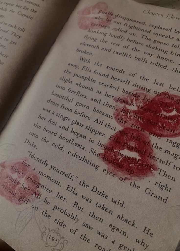 an open book with red ink on it