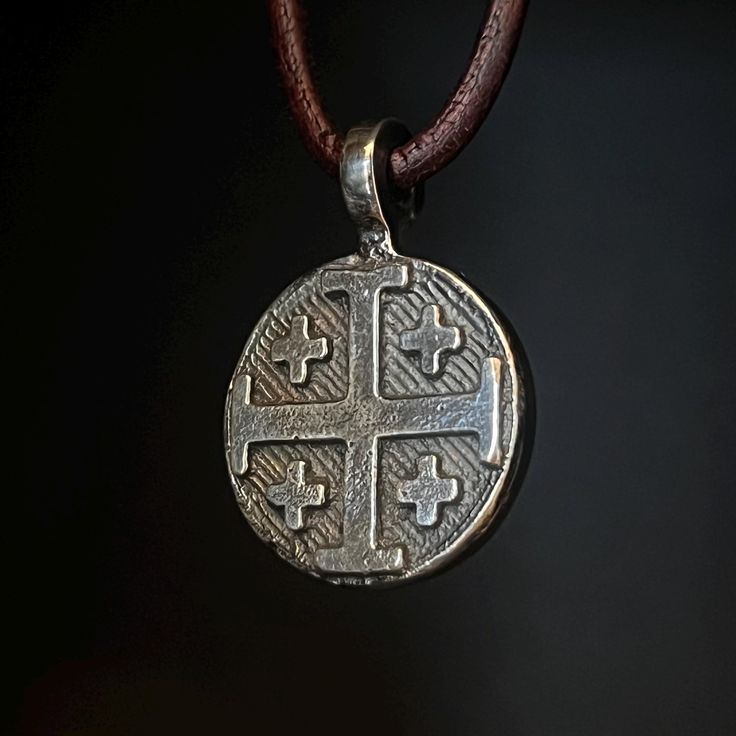 Made to Order, current wait time is 2-3 weeks.  As the owner and artisan behind Valkyrie Steel in Bigfork, Montana, I take great pride in transforming raw materials into meaningful, handcrafted pieces. This Jerusalem Cross pendant is crafted from fine silver, beginning its journey with a reverence for tradition and faith. The Jerusalem Cross, symbolizing the spread of Christianity to the four corners of the earth, is a powerful and timeless design. To create this pendant, I melt fine silver until it reaches a molten state, glowing with an intensity that reflects its transformation. The molten silver is then carefully poured into a custom mold, capturing the intricate lines and symmetry of the Jerusalem Cross. As the silver cools, the pendant takes its shape, unique in texture and finish, a Engraved White Gold Artisan Jewelry, Artisan Engraved White Gold Jewelry, Hand Forged Silver Jewelry, Medieval Engraved Jewelry For Anniversary, Antique Silver Handmade Artisan Jewelry, Artisan Antique Silver Sterling Silver Jewelry, Handmade Silver Cross Pendant Necklace, Handmade Silver Necklace With Cross Pendant, Handmade Artisan Antique Silver Jewelry