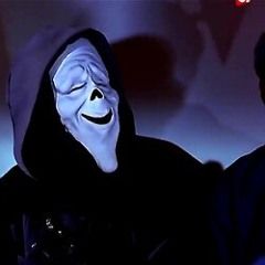 a man in a black hoodie with a creepy mask on and another guy wearing a white mask behind him