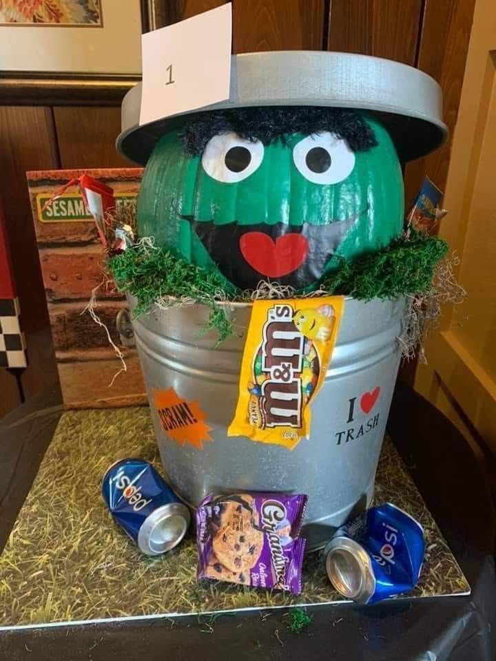 a bucket filled with candy sitting on top of a table