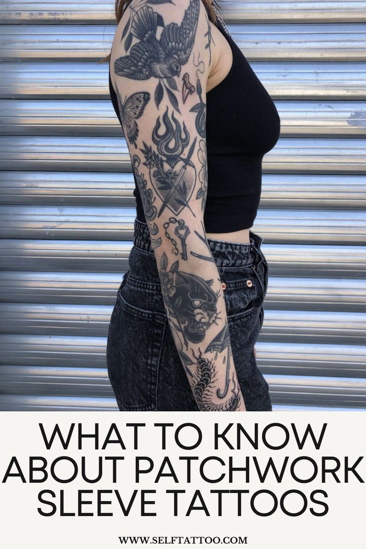 a woman with tattoos on her arm and shoulder, standing in front of a garage door