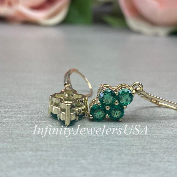 These Lever Back earrings are a lab created round emeralds, made with pure 14k yellow gold, #6873 Would make a perfect gift for a May Birthday, Mothers Pendant, a graduation, anniversary, bridal gift or just a gift for her. Other color gems are available, inquire for pricing. - 1.00 ct each -Approximate total carat weight: 2.00 ct -Gem Type: Lab created emerald -Stone Shape: 8 Round / 4MM -Stone Color: Lively rich green -Stone Clarity: VS2 -Hardness: 8.5 -Metal Type and Purity: 14k yellow gold C Green Prong Setting Earrings In Fine Jewelry Style, Fine Jewelry Emerald Cut May Birthstone Earrings, May Birthstone Emerald Cut Fine Jewelry Earrings, Fine Jewelry Emerald Cut Earrings For May Birthstone, Round Gemstone Cluster Earrings For Anniversary, Classic Emerald Earrings With Prong Setting, Gemstone Cluster Earrings For Anniversary, Green Emerald Earrings With Prong Setting, Classic Emerald Earrings For Anniversary