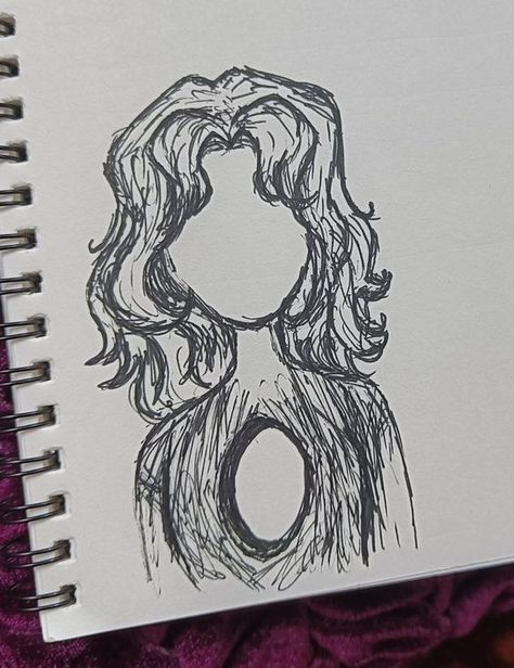 a notebook with a drawing of a woman's face