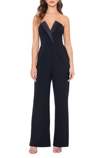 A tuxedo-inspired strapless bodice brings black-tie glamour to this jumpsuit crafted in a wide-leg silhouette and furnished with a pair of handy pockets. Hidden back-zip closure Deep V-neck Strapless Front slant pockets Lined 94% polyester, 6% spandex Spot clean Made in the USA Elegant Full-length Strapless Jumpsuit For Party, Elegant Tailored Pantsuit For Party, Glamorous Black Jumpsuits And Rompers For Formal Occasions, Luxury Jumpsuits And Rompers For Gala, Glamorous Black Formal Jumpsuits And Rompers, Elegant Strapless Jumpsuits And Rompers For Party, Elegant Black Jumpsuits And Rompers For Gala, Glamorous Fitted Jumpsuits And Rompers For Formal Events, Glamorous Fitted Jumpsuits And Rompers For Formal Occasions