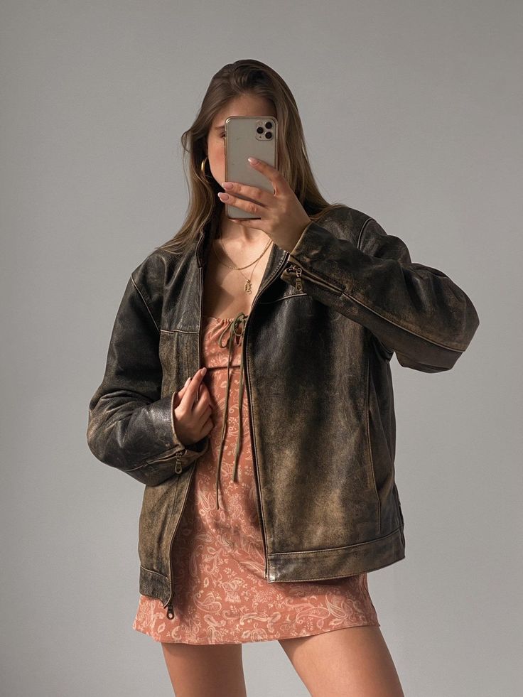 Oversized Biker Jacket | Distressed Brown Genuine Leather Indulge in timeless elegance with our **60s Oversized Biker Jacket crafted from distressed brown genuine leather** for women who embrace vintage Moto rider style and streetwear sophistication. This jacket features an oversized silhouette, channeling the bold aesthetic of the iconic 80s biker era. Key Features: Buttery Soft Tanned Leather Enjoy the luxurious feel of real leather with a rich color and unique aroma. Traditional Craftsmanship Oversized Jacket With Dress, Boxy Jacket Outfit, Vintage Brown Leather Jacket Outfit, Vintage Leather Jacket Outfits, Boxy Leather Jacket, Oversize Leather Jacket, Old Leather Jacket, Leather Jacket With Fringe, Brown Leather Jacket Outfit