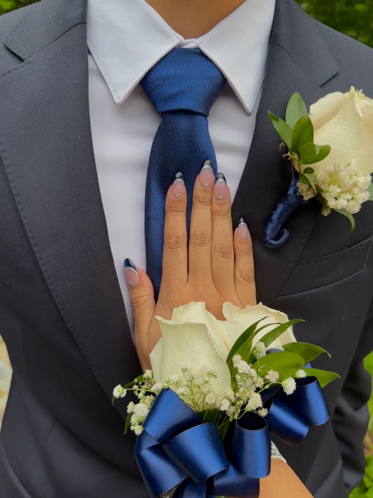 Prom Suits And Dresses, Black Prom Dress With Blue Accessories, Navy Suit Homecoming, Black Suit With Royal Blue Tie, Corsage Navy Blue Dress, Suits To Go With Navy Prom Dress, Black Suit With Blue Bow Tie, Black Suit With Navy Blue Tie, Suits With Blue Tie