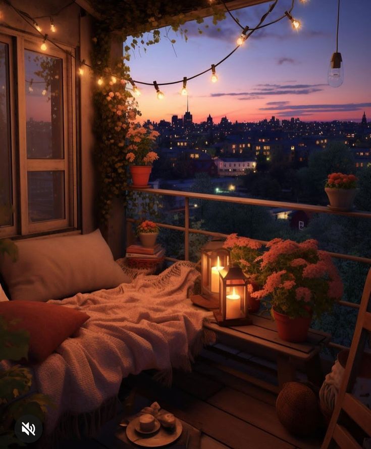 a balcony with candles and flowers on the windowsill at night, lit by string lights