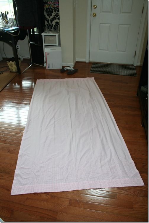 a white sheet is laying on the floor