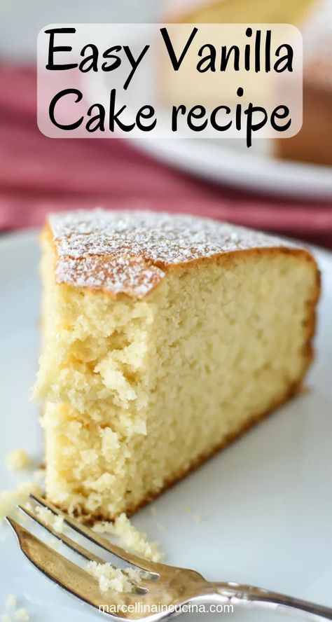 a slice of vanilla cake on a plate with a fork