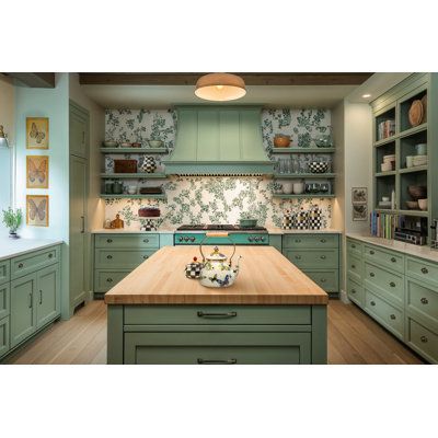 a kitchen with green cabinets and wooden counter tops