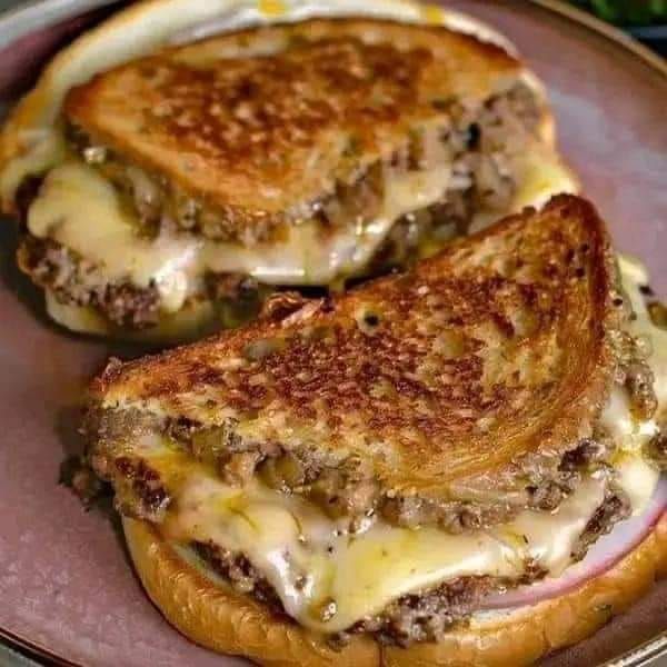 two grilled cheese sandwiches on a plate