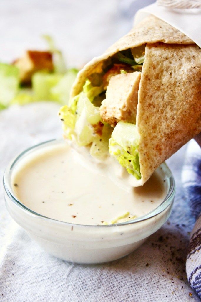 a pita filled with lettuce and sauce