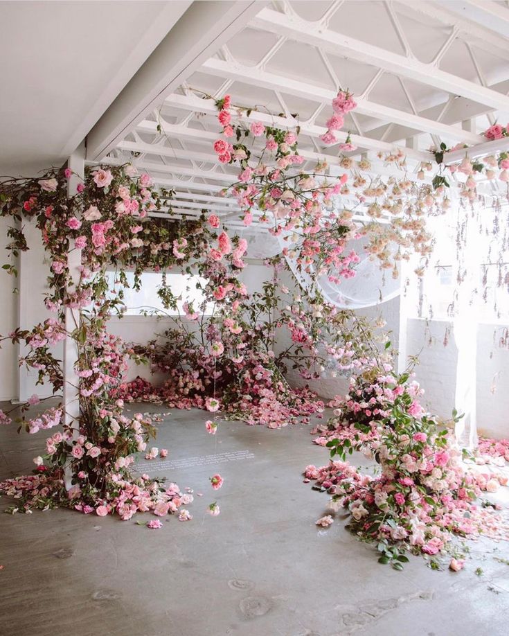 a room filled with lots of pink flowers