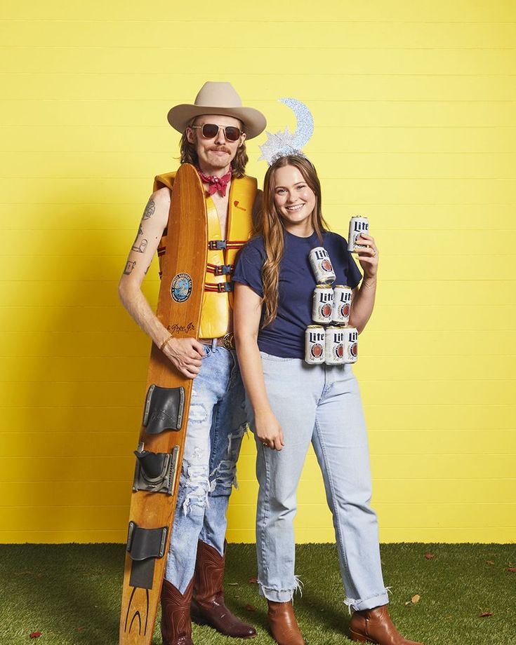 a man and woman dressed up as woody and the person from toy story land posing for a photo