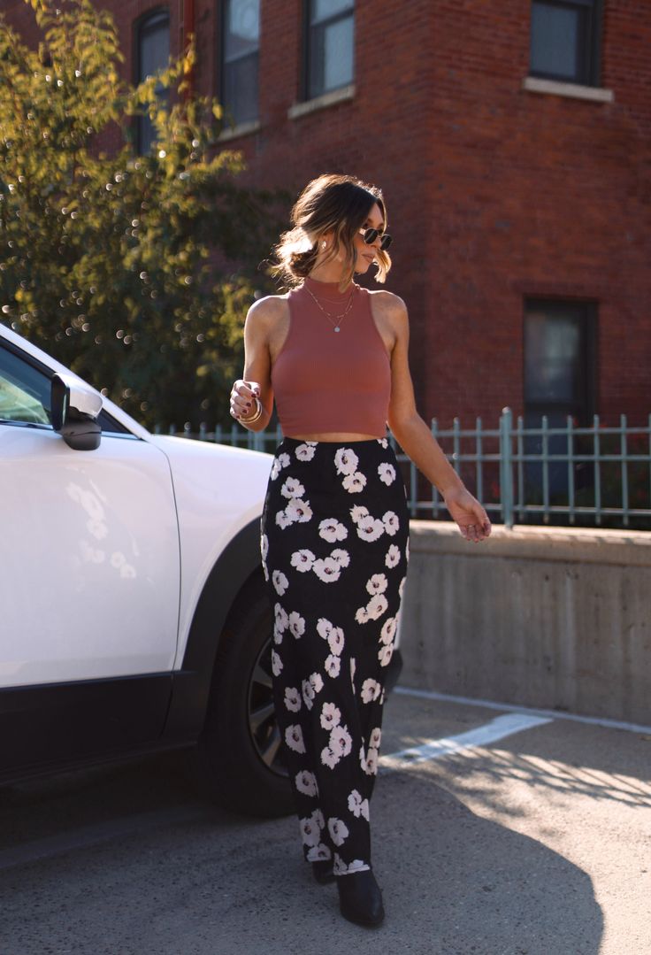 Look effortlessly chic in our Secret Rumor Floral Skirt! This stunning maxi skirt features a chic floral print and is made with lightweight fabric for a comfortable and flattering fit. Dress it down with a tank top or pair it with a cozy sweater for colder weather. Make a statement and feel your best! Fabric 100% polyester Lane 201, Black Mock Neck, Mock Neck Tank, The Lane, Our Secret, Ribbed Turtleneck, Fit Dress, Cozy Sweater, Cozy Sweaters