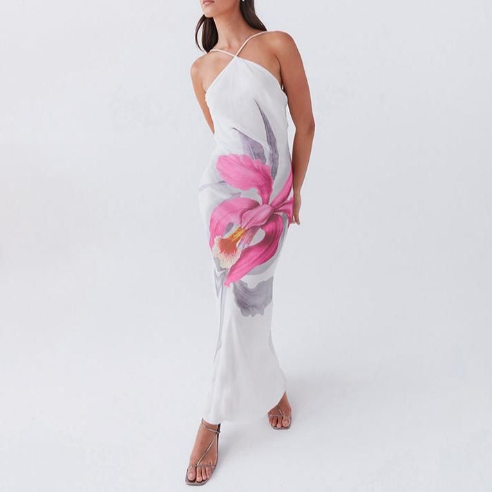 Let the Liliana Floral Maxi Dress take you on a romantic summer adventure. With a cross halterneck and backless design, this dress is perfect for beach days or resort getaways. The large floral print adds a touch of whimsy to this elegant piece. From Good Girl Things Summer in Bloom Collection. Details Eliza Floral Maxi Dress in White Cross halterneck Backless Large floral printed long dresss Romantic summer dress, resort dress Good Girl Things Summer in Bloom Collection White Bohemian Maxi Dress For Summer Parties, White Beachy Dress For Summer Parties, Floral Print Backless Maxi Dress For Beach Season, Backless Floral Maxi Dress For Beach Season, Spring Beachwear Halter Dress With Spaghetti Straps, White Beach Dress For Summer Parties In Spring, White Beach Dress For Summer Parties, Spring Poolside Halter Neck Maxi Dress, Sleeveless Hibiscus Print Sundress For Beach