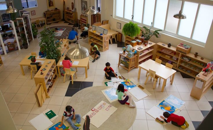 an overhead view of children's playrooms and tables in a school library