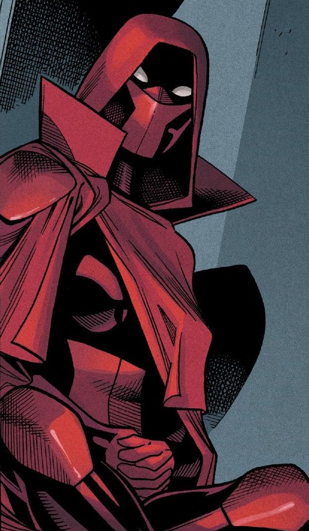 a man in a red cape and black mask