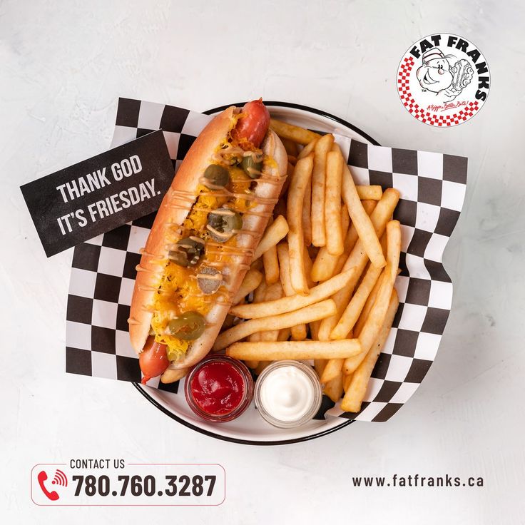 a hot dog and french fries on a checkered plate