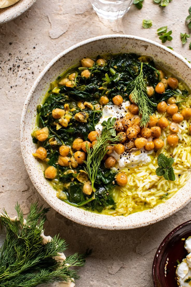 a white bowl filled with rice and chickpeas