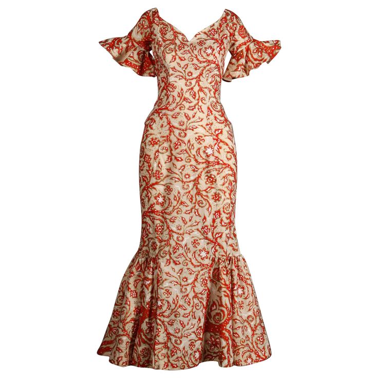 Rare 1950s Hawaiian dress made by Surf and Shore in Honolulu. Mouth watering vintage hand pulled screen printed fabric in orange, white and metallic gold. Dramatic flared bell sleeves and plunging neckline. 1950s bombshell hourglass silhouette! Unlined with rear metal zip and hook closure. The fabric content feels like cotton but is unmarked. Fits like a modern size XS. The bust measures 34", waist, 24", hips 35", and total length 52.5". The bottom hem has about 1.5"-2" that can be let out. Excellent vintage condition with no noted flaws. The fabric is still nice and crisp. Made in the USA. Islander Dresses Design, Puletasi Designs, Hawaiian Dress Pattern, Traditional Hawaiian Dress, 1950s Bombshell, Samoan Clothing, Dress Hawaiian Style, Samoan Dress, Hawaiian Muumuu