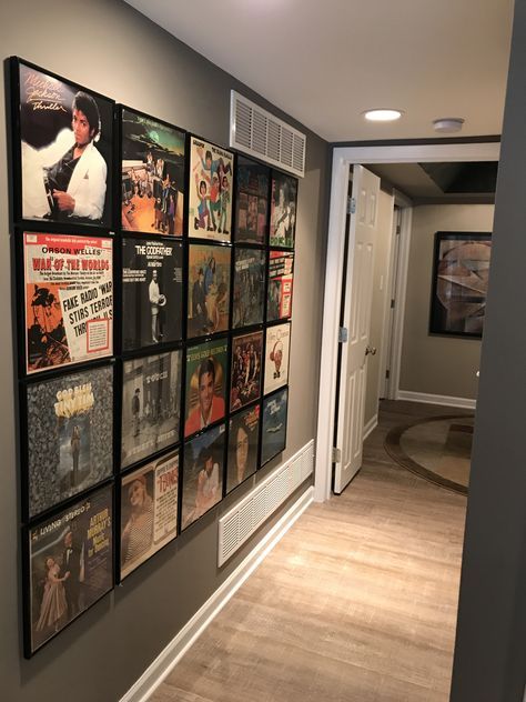 a hallway with posters on the wall