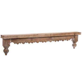 an old wooden bench with scalloped legs on a white background for display purposes