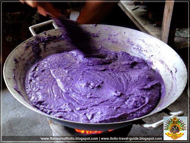 a pan filled with purple food sitting on top of a stove