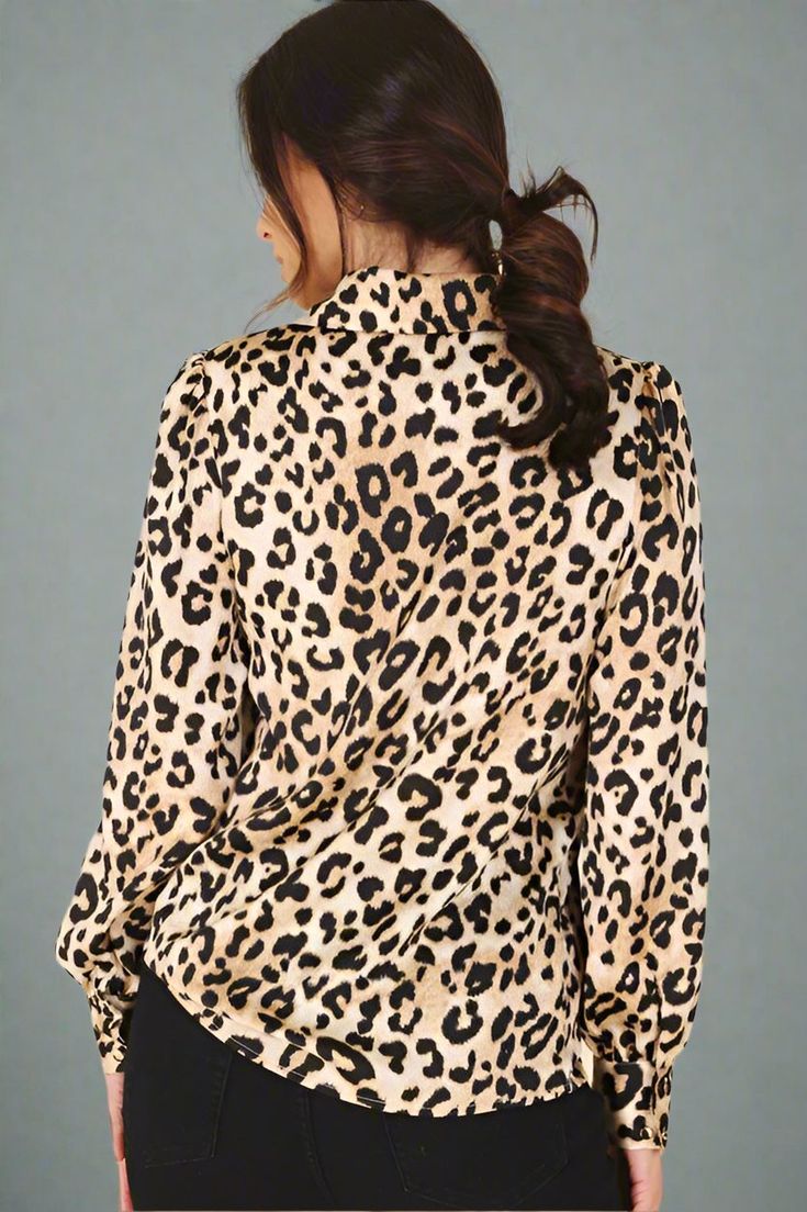 This leopard print blouse exudes luxury and sophistication. The soft, silky material provides a comfortable and stylish fit, making it a versatile addition to any wardrobe. With its eye-catching print this top is perfect for any occasion. Regular fit Long sleeves Material polyester Machine wash cold Model is 5'9" and wears US small S: 17.5" (Bust), 13.5" (Shoulder), 25.75" (Length), 21" (Sleeve Length) M: 18.5" (Bust), 14" (Shoulder), 26.25" (Length), 24.5" (Sleeve Length) L: 19.5" (Bust), 14.5" Chic Leopard Print Party Top, Chic Leopard Print Top For Party, Trendy Leopard Print V-neck Blouse, Chic Leopard Print Blouse For Party, Leopard Print V-neck Tops For Night Out, Elegant Leopard Print Party Blouse, Trendy Leopard Print Party Blouse, Spring Leopard Print Workwear Blouse, Trendy Leopard Print Blouse For Party