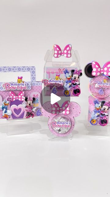 three minnie mouse toys in plastic boxes