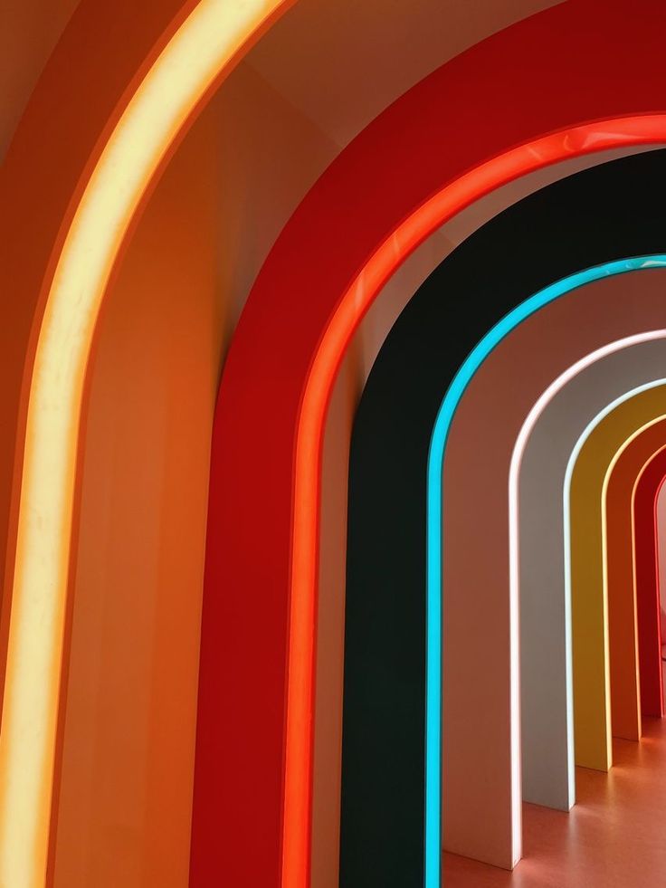 an image of a tunnel with neon lights on the walls and floor in front of it