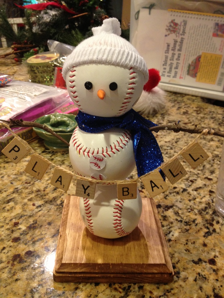 a snowman made out of baseballs on top of a counter